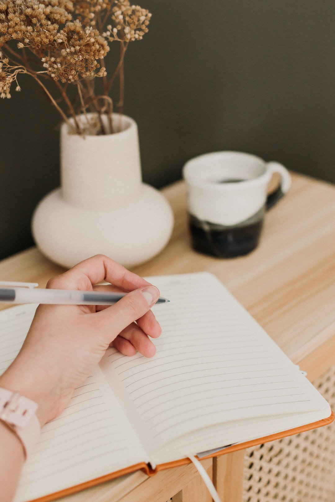 person writing in journal
